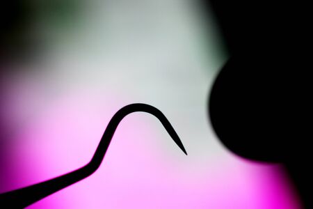 Dentists dental equipment mirror and tooth pick to remove plaqueの写真素材