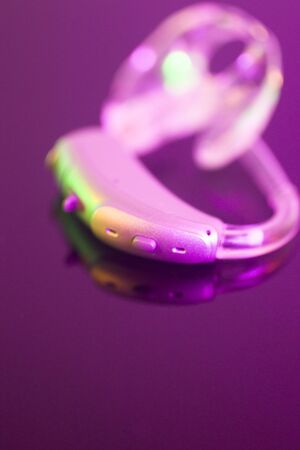 Modern digital hearing aid for deafness and deaf people.