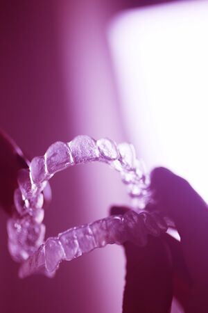 Clear dental teeth retainer brackets to straighten and align each tooth in modern dentistry...