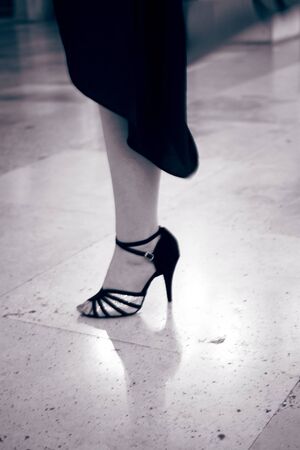 Ballroom latin salsa hot sexy female dancer dancing in modern sport dance showwith slim long legs,の写真素材