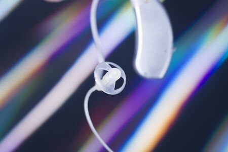 Modern high technology digital hearing aid closeup isolated.
