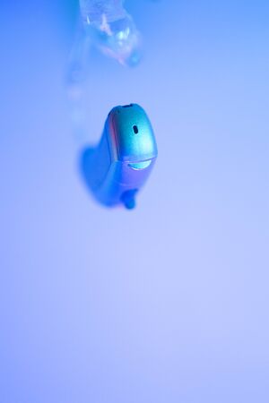 Modern digital hearing aid for deafness and deaf people.の写真素材
