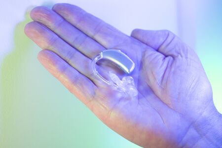 Modern digital hearing aid for deafness and deaf people.