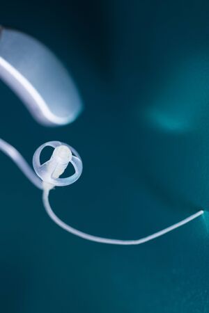 Modern high technology digital hearing aid closeup isolated.の写真素材
