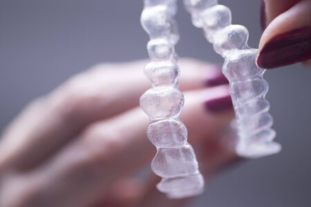 Clear dental teeth retainer brackets to straighten and align each tooth in modern dentistry...