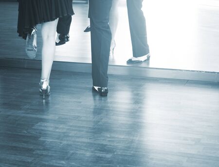 Ballroom dance couple of dancers and teachers in studio school dancing in rehearsal.の写真素材