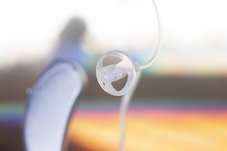 Modern high technology digital hearing aid closeup isolated.の写真素材