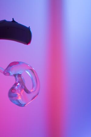 Modern digital hearing aid for deafness and deaf people.の写真素材