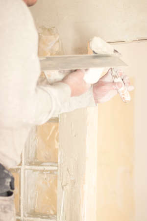 Building renovation works in appartment showing refurbishments works by builders to renovate walls.の写真素材