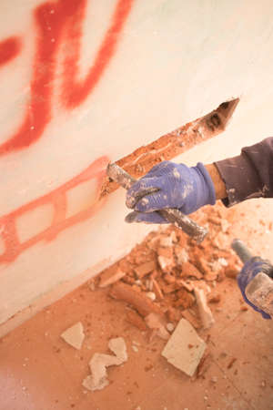 Building renovation works in appartment work by builders to renovate walls.の写真素材