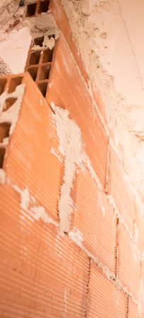 Building renovation works in appartment showing refurbishments works by builders to renovate walls.の写真素材