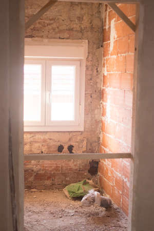 Building renovation works in appartment showing refurbishments works by builders to renovate walls.の写真素材