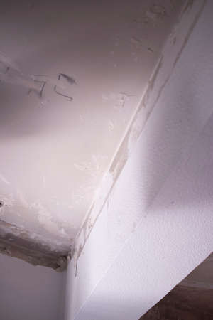Building renovation works in appartment work by builders to renovate walls.の写真素材