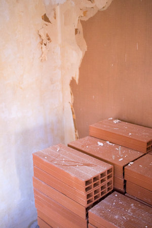Building renovation works in appartment work by builders to renovate walls.の写真素材