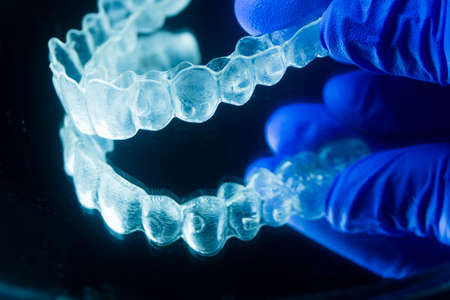 Modern invisible brackets aligner straighterners used to correct alignment on teeth by dentists.