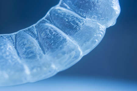 Modern invisible brackets aligner straighterners used to correct alignment on teeth by dentists.の写真素材