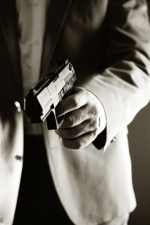 Retro secret agent with pistol revolver gun in hand in vintage crime thriller mockup cover    ...