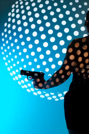 Lady spy detective holding pistol gun.