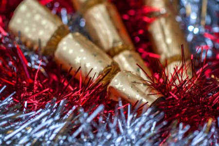 Christmas Crackers and Tinsel - red, gold, silver の写真素材
