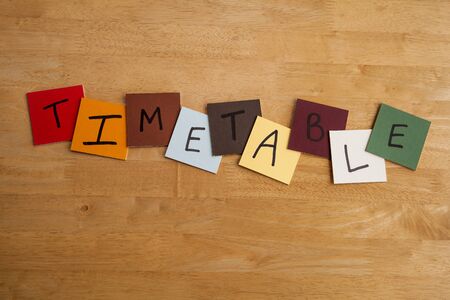 TIMETABLE in letters on brightly colored square tiles, ideal for Business, Education or Schools.の写真素材