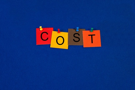 Cost - Business terms sign series, tiles and letters on noticeboard with pins.の写真素材