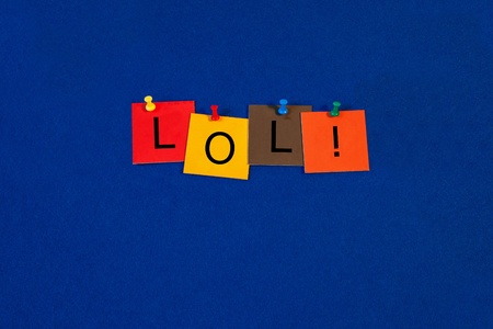 LOL -  Business terms sign series, tiles and letters on noticeboard with pins.の写真素材