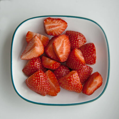 Strawberries on dish, fresh, juicy, cut and sliced. の写真素材