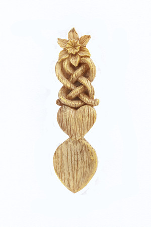 Celtic or Welsh Love Spoon, traditional carving, isolated on white.の写真素材