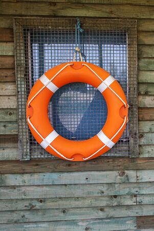 Life Ring or Life Buoy on Hut, symbol for watersports and water safety, with text space.の写真素材