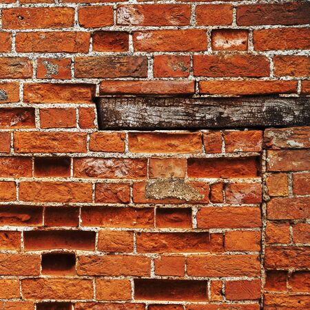 Brick wall background, square with wooden plinth and red bricks.の写真素材