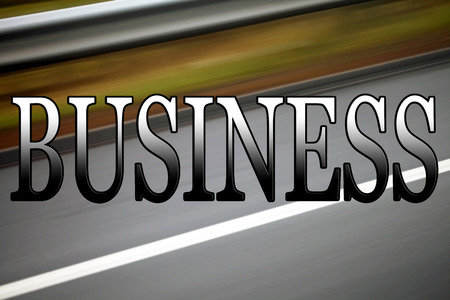 Business sign, for themes of transport costs, with road background.の写真素材