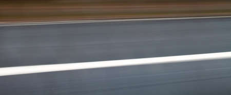 Urban highway / road speed backgrounds - panorama of blurred street.の写真素材