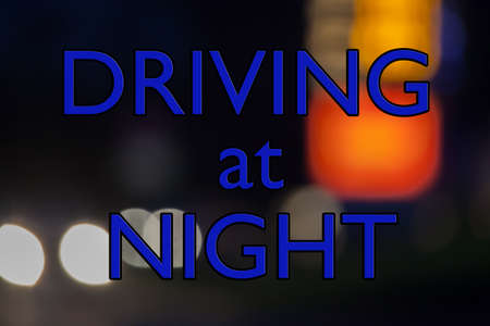 Driving at Night - sign concept for transport and highways after dark, headlights, hazards and danger.の写真素材