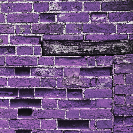 Purple brick wall background texture, with wooden plinth.の写真素材