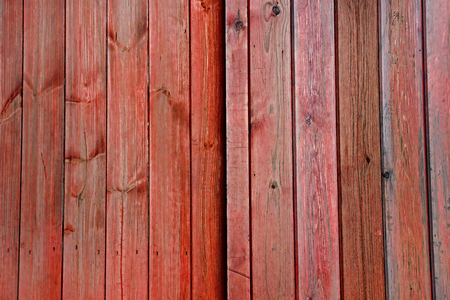 Orange faded wooden doors / planks / panels / vertical slats - Stripes Pattern as a Background Texture.の写真素材