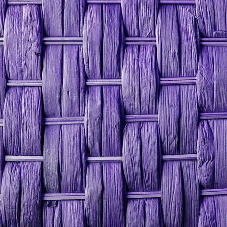 Imaginative purple woven reed  wood abstract background texture.の写真素材