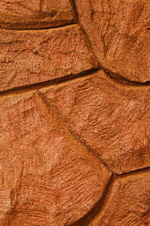 Imaginative orange stone  concrete  rock background texture, with curvy patterns.の写真素材