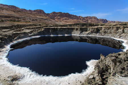 Unique black lake in the dead seaの写真素材