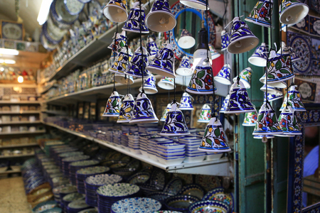 Ceramic plates and other souvenirs for sale located on Arab baazar inside the walls of the Old City of Jerusalemのeditorial素材