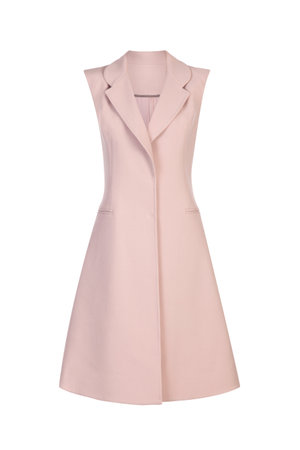 Women's sleeveless jacket in peach color on a white backgroundの写真素材