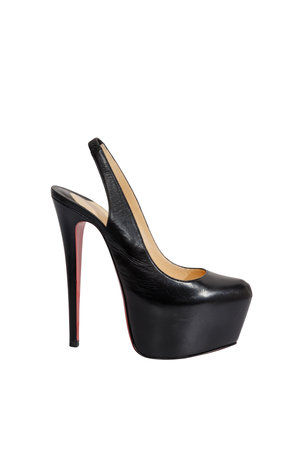 Women's high-heeled shoes with an open heel made of black leather on a white backgroundの写真素材