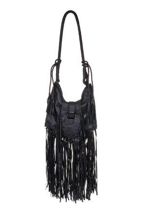 Women's black leather bag with fringes on a white backgroundの写真素材