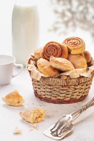 Fresh tasty pastries on white wooden table, closeupの写真素材