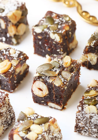 Turkish delight with nuts and pistachios on a white background.の写真素材