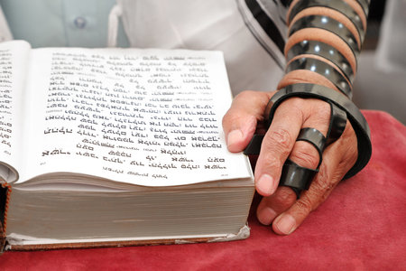 An jewish man is reading his bible and prayingの写真素材