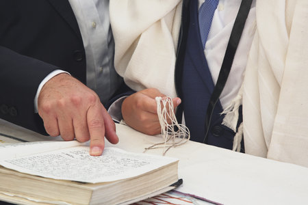 Bar Mitzvah ritual at the Wailing wall .Boy who has become a Bar Mitzvah is morally and ethically responsible for his decisions and actions.の写真素材
