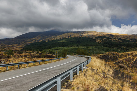 Mountain road on Mount Etna volcano in Sicily, Italyの写真素材
