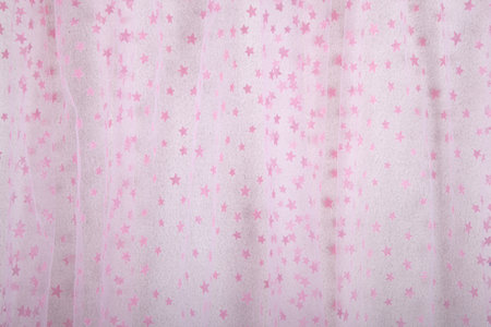 Fine mesh netting with fluffy pink stars fabric or material, suitable for baby background or wallpaper with graphic design or AI usage. Concept for other compsitionsの写真素材