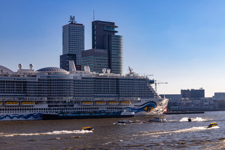 Rotterdam, Netherlands - 3-3-2022: Aida Cosma in port of Rotterdam on a sunny day, taking on LNG fuel surrounded by water taxisのeditorial素材