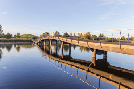 Barendrecht, the Netherlands - 2021-09-21: Bridge overGaatsplas in Barendrecht, the Netherlands, with a reflection in the waterのeditorial素材